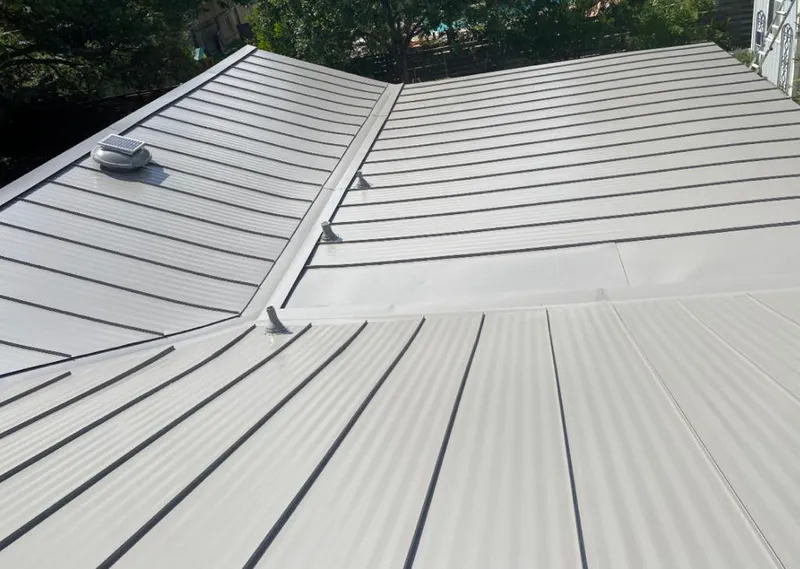 Solar attic fan installed on a metal roof for Roof Ventilation in Spotswood